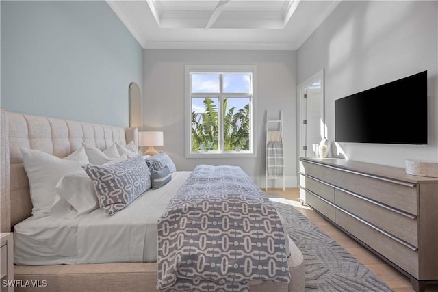 bedroom featuring light hardwood / wood-style floors and crown molding