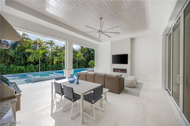 exterior space with an outdoor hangout area and ceiling fan