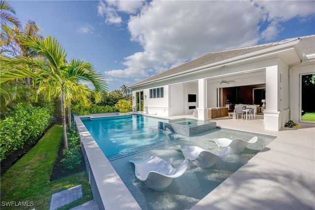 view of swimming pool featuring an in ground hot tub, ceiling fan, and a patio area