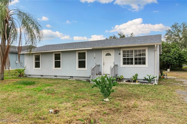 ranch-style home with a front yard