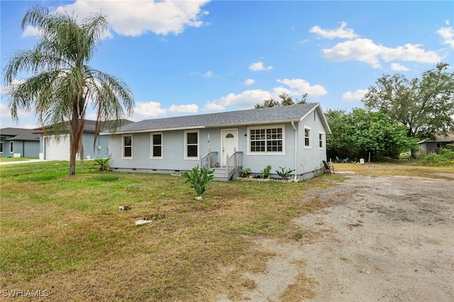 ranch-style home featuring a front lawn