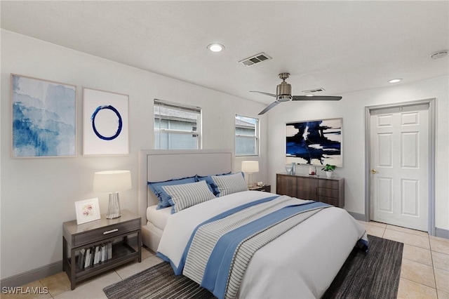 tiled bedroom featuring ceiling fan