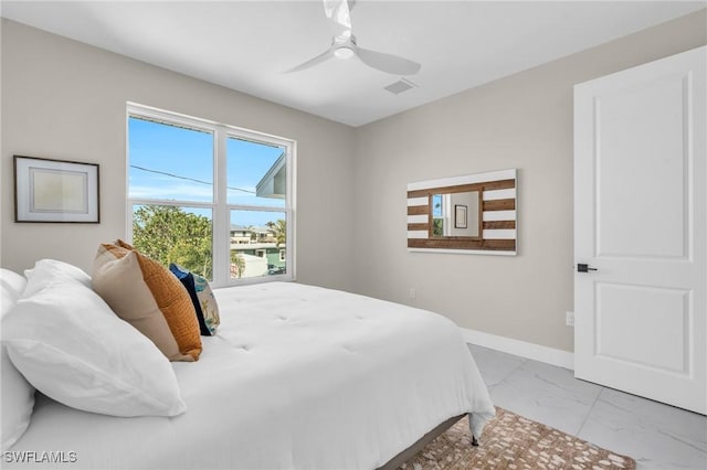 bedroom featuring marble finish floor, visible vents, baseboards, and ceiling fan