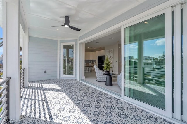 view of patio / terrace featuring ceiling fan