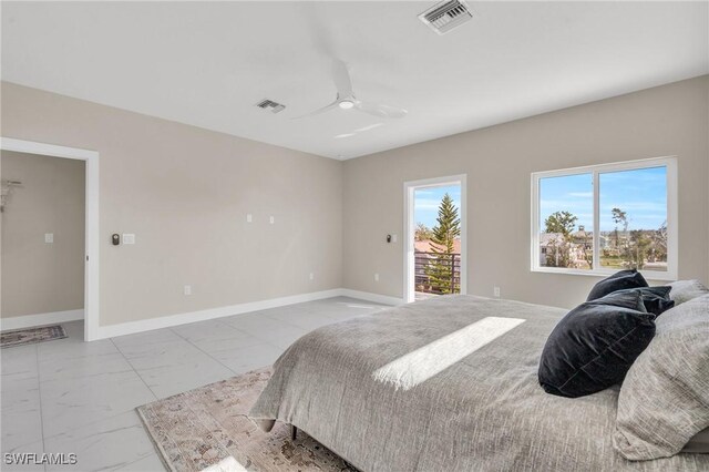 bedroom featuring ceiling fan and access to exterior