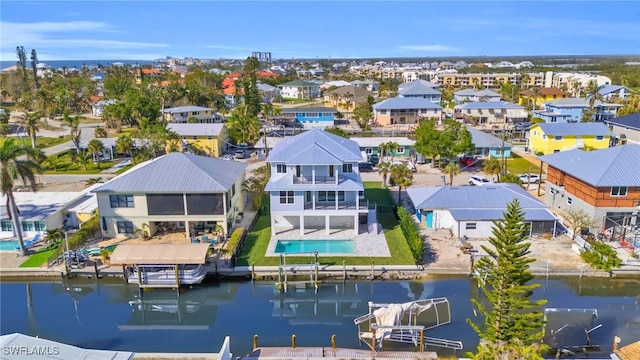 birds eye view of property featuring a residential view and a water view