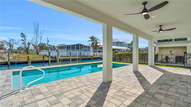 view of pool with ceiling fan and a patio area