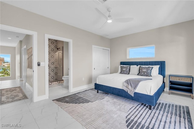 bedroom with ceiling fan and connected bathroom