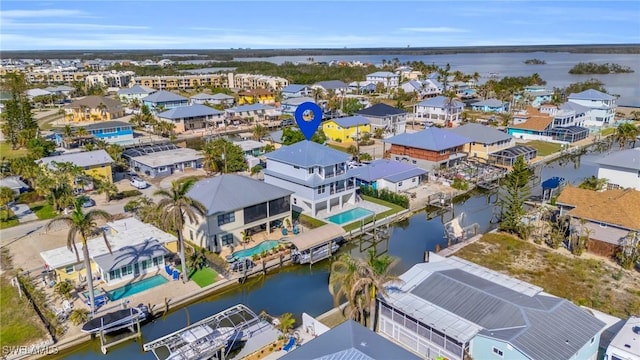 aerial view featuring a water view and a residential view