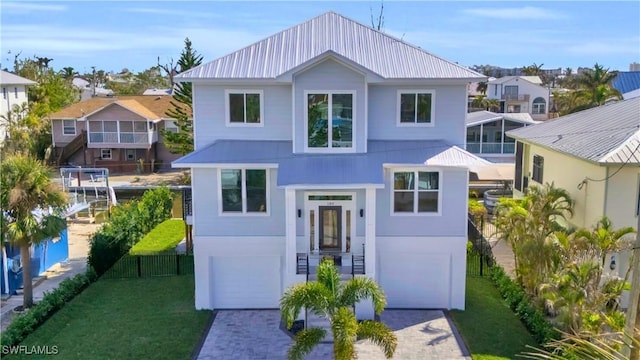 view of front of property with a garage and a front yard