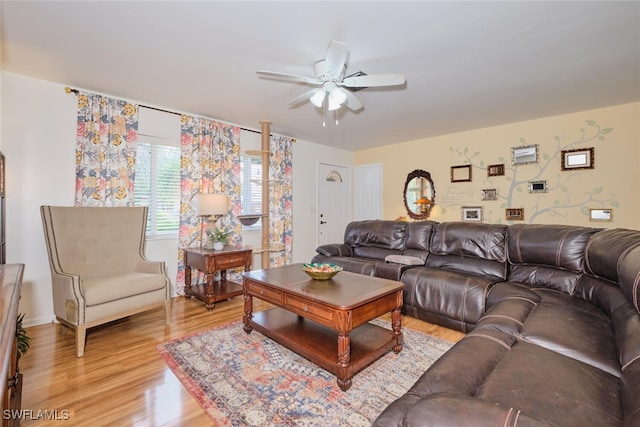 living room featuring ceiling fan and wood-type flooring