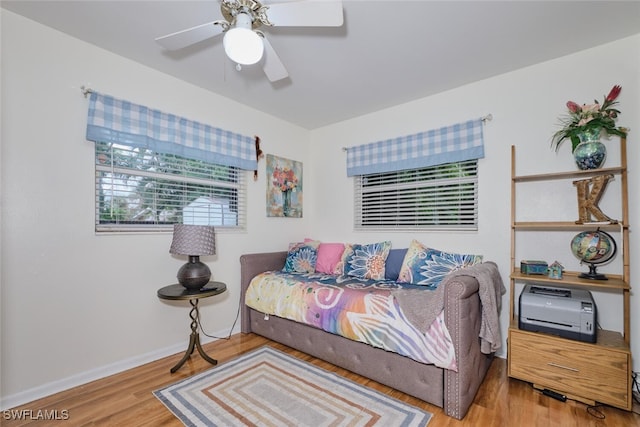 bedroom with ceiling fan and hardwood / wood-style floors