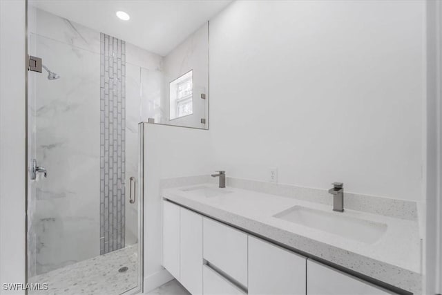 bathroom with vanity and an enclosed shower