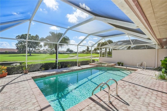 view of swimming pool with glass enclosure, an in ground hot tub, and a patio