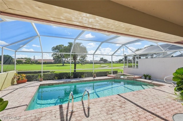 view of pool with an in ground hot tub, a patio area, and a lanai