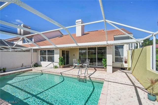 view of pool featuring a lanai and a patio area