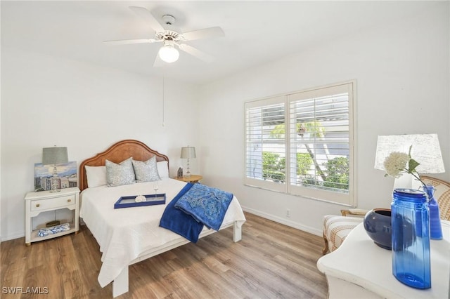 bedroom featuring ceiling fan and hardwood / wood-style flooring