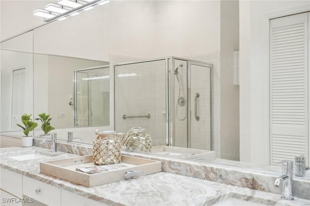 bathroom with vanity and walk in shower