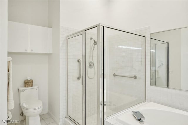 bathroom featuring toilet, shower with separate bathtub, and tile patterned floors