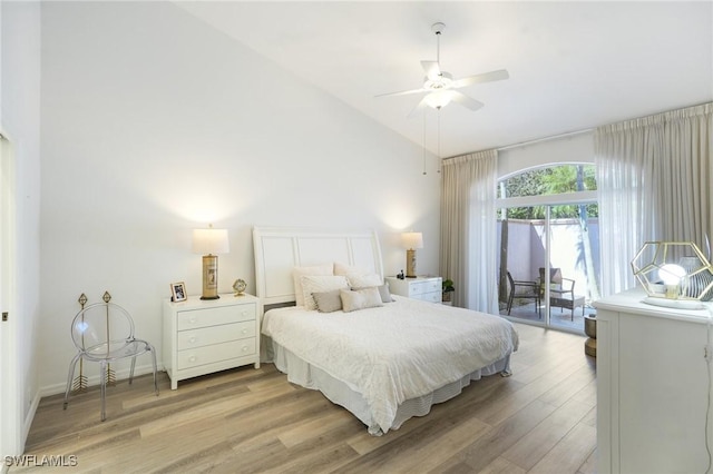 bedroom with vaulted ceiling, light hardwood / wood-style flooring, and ceiling fan