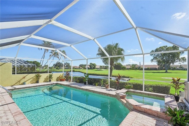 view of pool with a water view and glass enclosure