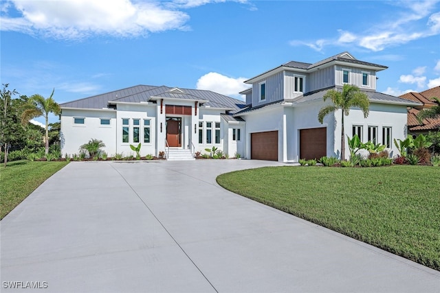 view of front facade featuring a garage and a front lawn