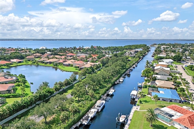 birds eye view of property featuring a water view