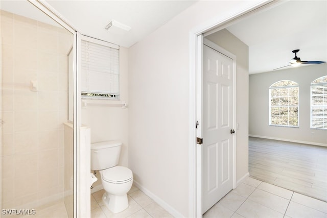 bathroom featuring walk in shower, wood-type flooring, toilet, and ceiling fan