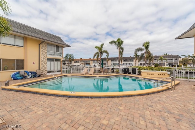 view of swimming pool with a patio area