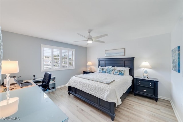 bedroom with ceiling fan and light hardwood / wood-style flooring