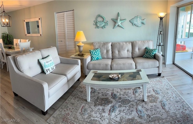 living room featuring hardwood / wood-style floors and a chandelier