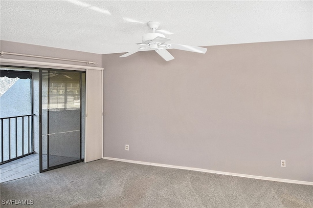 empty room featuring carpet flooring, a textured ceiling, and ceiling fan