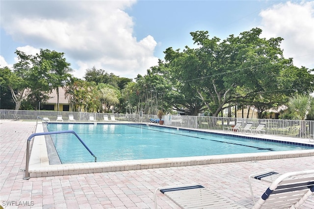 view of swimming pool with a patio