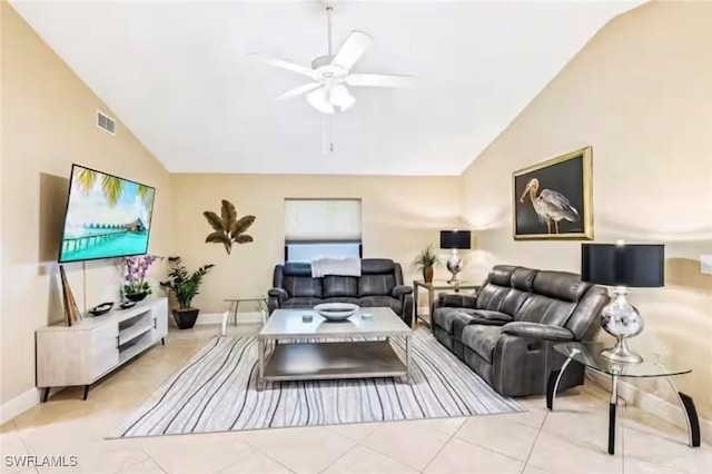 living room with lofted ceiling, light tile patterned floors, and ceiling fan