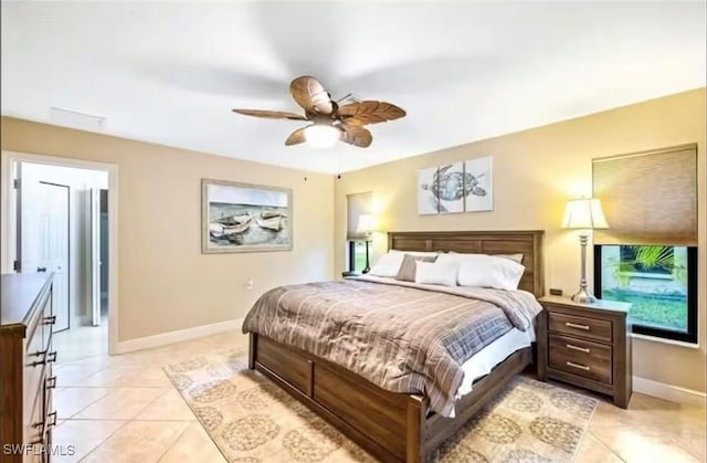 bedroom with ceiling fan and light tile patterned flooring