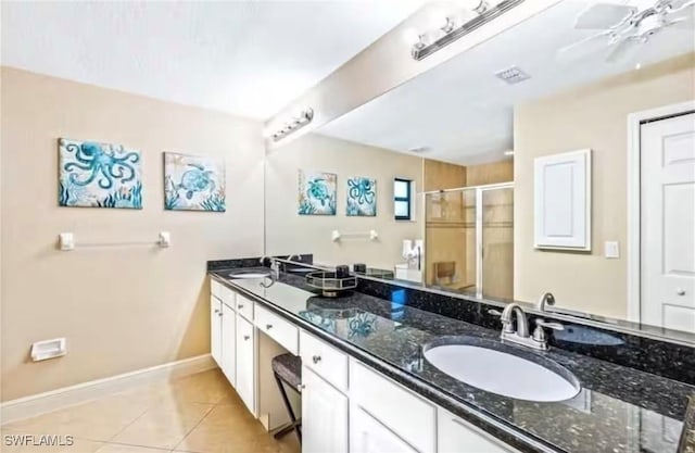 bathroom with ceiling fan, tile patterned floors, vanity, and a shower with shower door