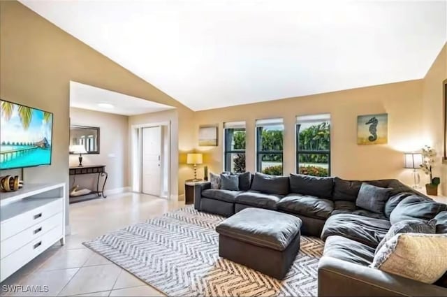 tiled living room with lofted ceiling