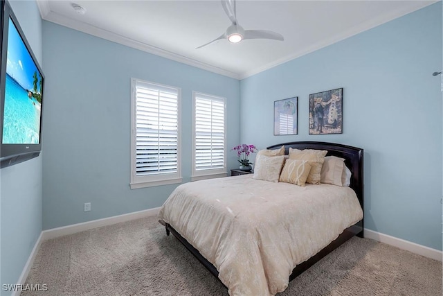 carpeted bedroom with ceiling fan and crown molding