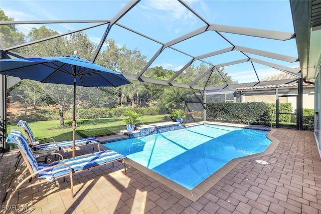 view of swimming pool featuring glass enclosure and a patio