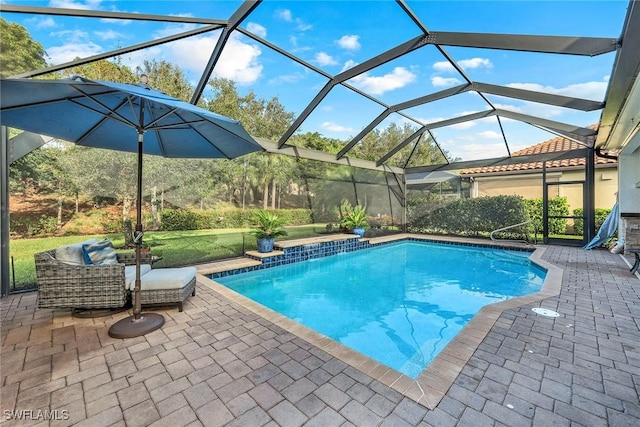 view of pool featuring a patio area and a lanai