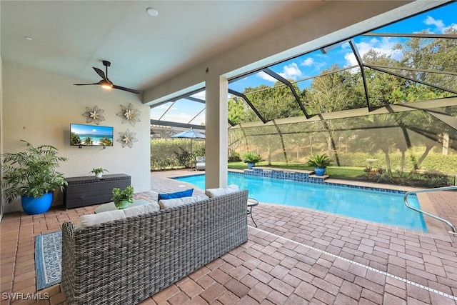 view of swimming pool featuring outdoor lounge area, a patio, and glass enclosure