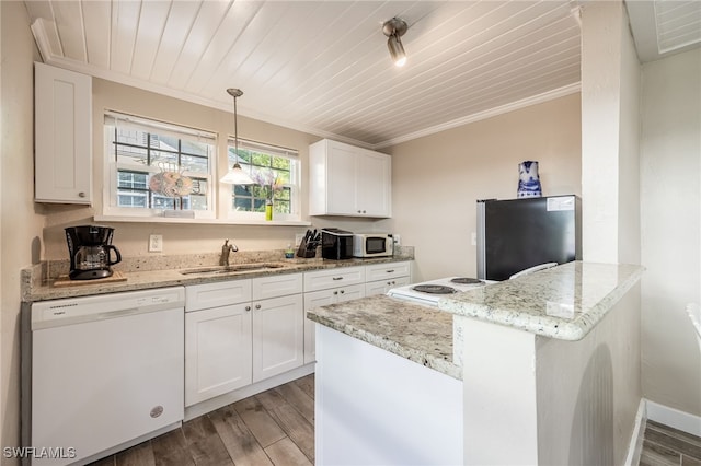 kitchen with sink, ornamental molding, white appliances, light stone countertops, and white cabinets