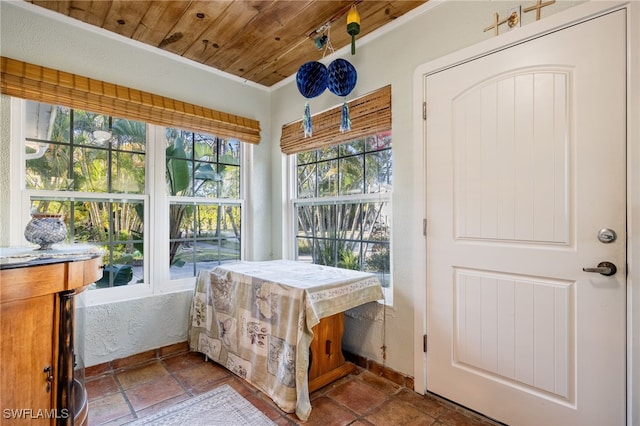 sunroom / solarium featuring wooden ceiling