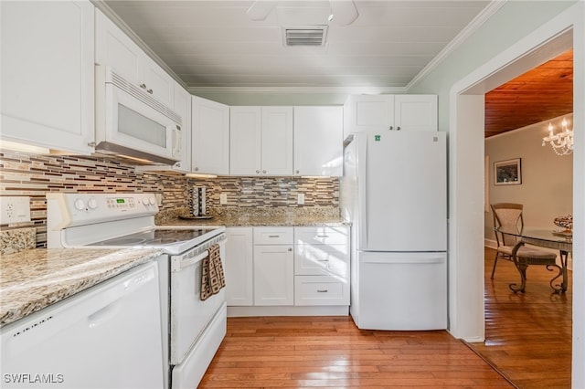 kitchen featuring light wood-type flooring, white appliances, visible vents, and white cabinetry