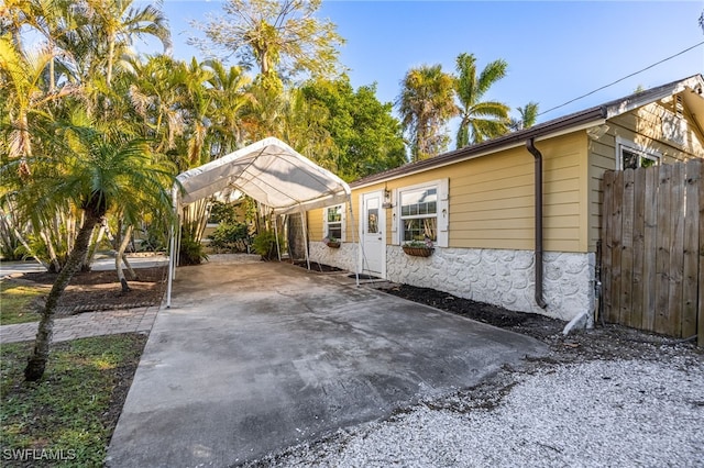 view of home's exterior featuring a carport