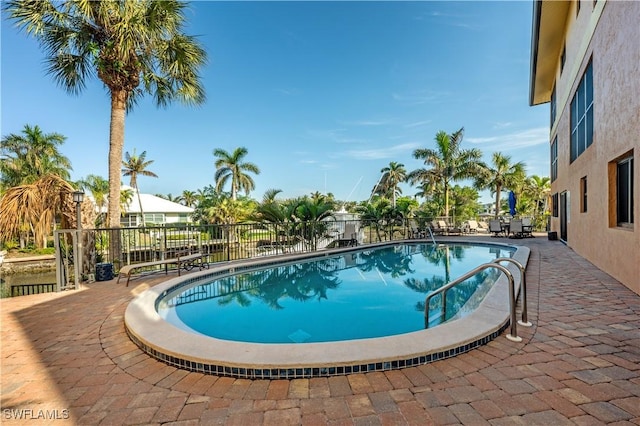 view of pool featuring a patio area