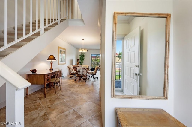 entrance foyer featuring ornamental molding