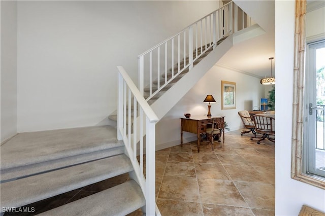 stairs featuring ornamental molding