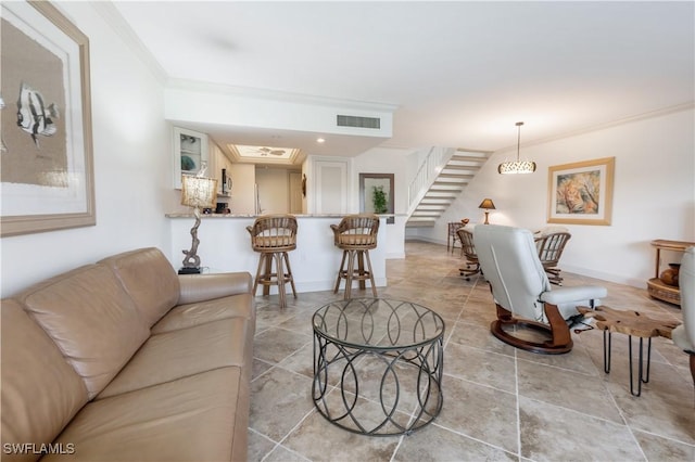 living room with ornamental molding