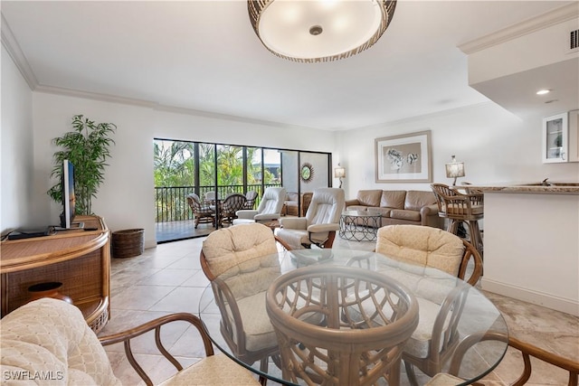 living room with light tile patterned floors and ornamental molding